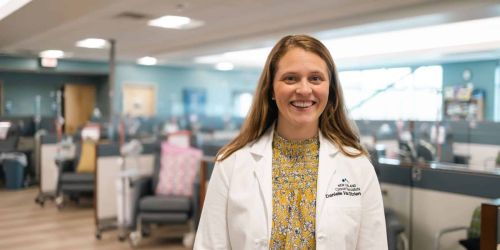 a woman sitting on a boat reading a book